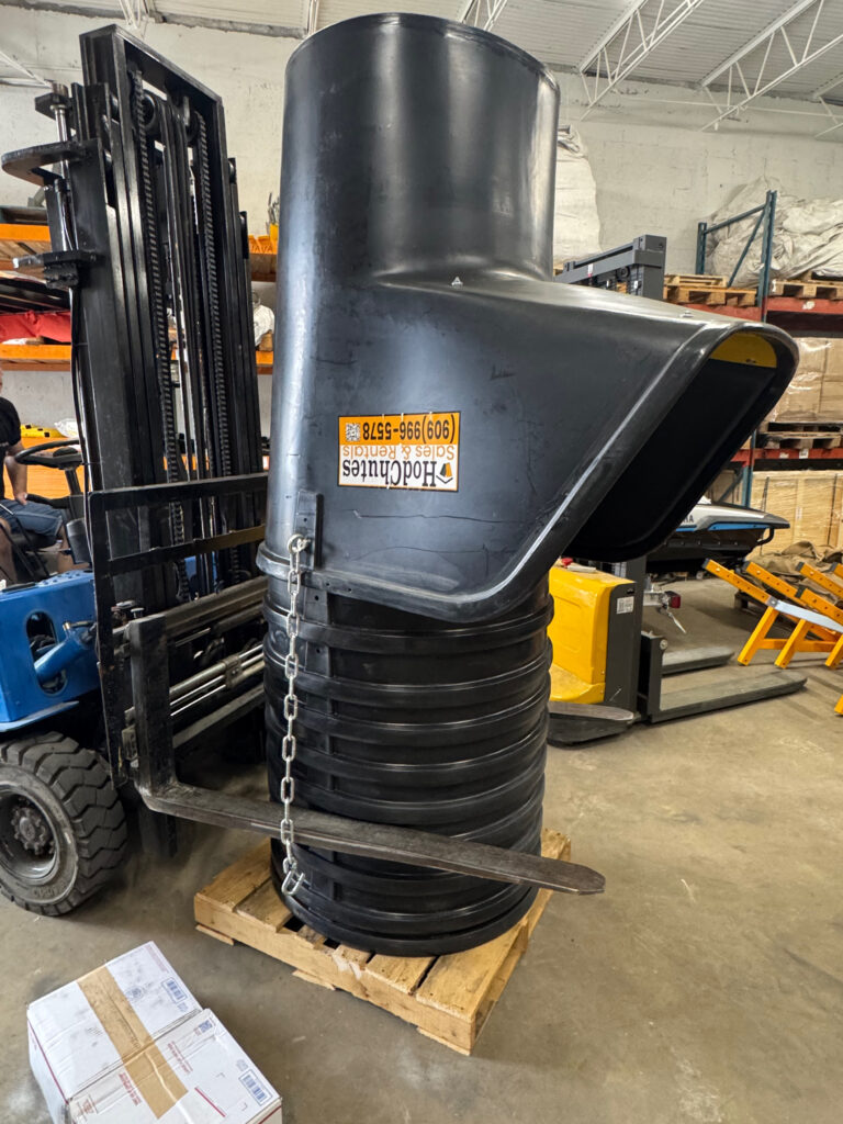 Temporary garbage chute for construction, non-penetrating mount installed on a job site