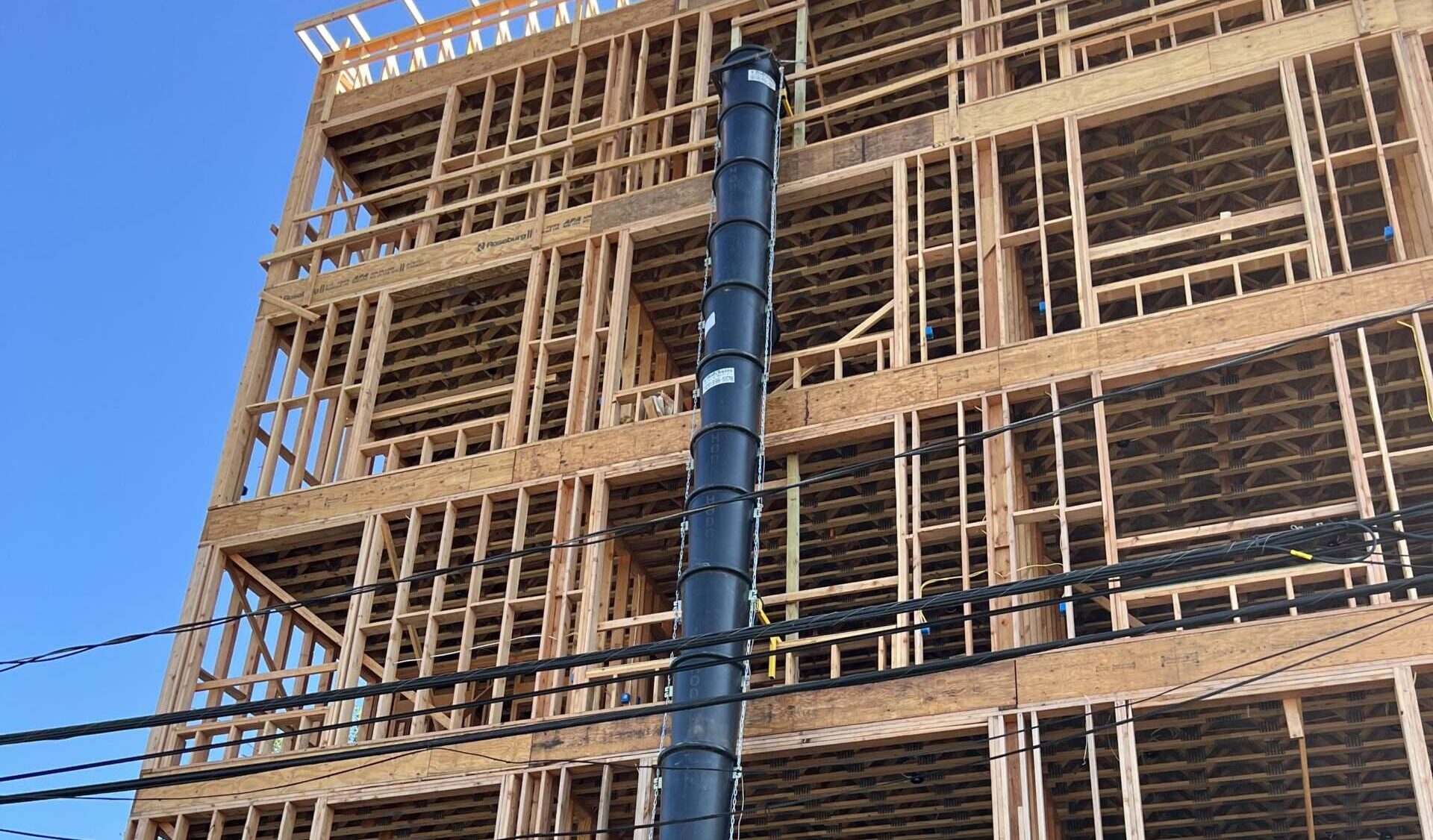 68358276379 A2B2DD21 2D34 45B8 8716 53C346848357 scaled e1735033756373 Construction Garbage Chute and Debris Shoots trash in a construction site - What is Debris and How Construction Site Trash Bins Help Manage It